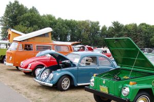 vw vehicles lined up at a show.